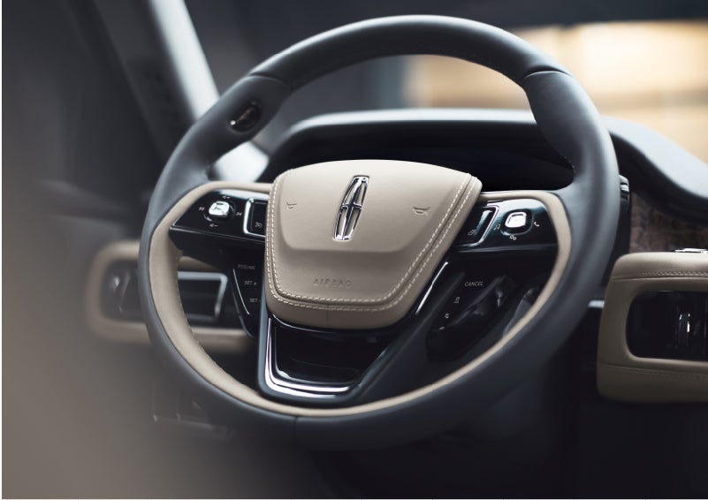 The intuitively placed controls of the steering wheel on a 2023 Lincoln Aviator® SUV | Casa Lincoln in El Paso TX