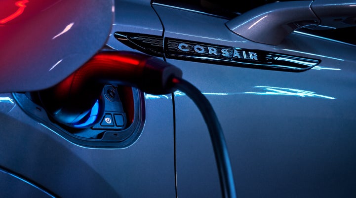 A charger plugged into the charging port of a 2024 Lincoln Corsair® Plug-in Hybrid model. | Casa Lincoln in El Paso TX