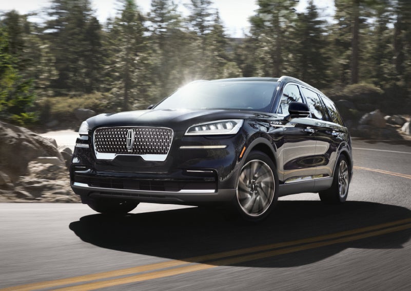 A Lincoln Aviator® SUV is being driven on a winding mountain road | Casa Lincoln in El Paso TX