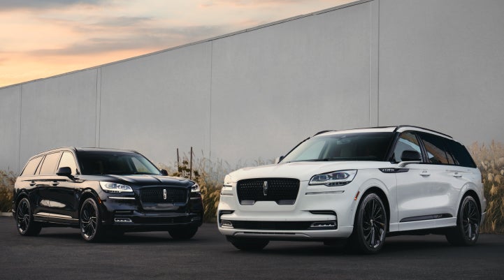 Two Lincoln Aviator® SUVs are shown with the available Jet Appearance Package | Casa Lincoln in El Paso TX