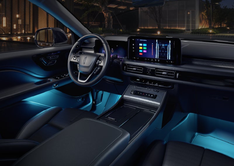 Deep blue ambient lighting glows from various places within a 2026 Lincoln Aviator® SUV. | Casa Lincoln in El Paso TX