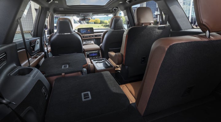 One side of the PowerFold® third-row seat and a second-row seat are folded forward in the 2026 Lincoln Aviator® SUV. | Casa Lincoln in El Paso TX