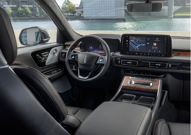 The interior of the 2026 Lincoln Aviator® SUV is shown parked with a view of a harbor through the windshield. | Casa Lincoln in El Paso TX
