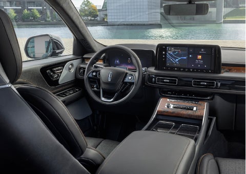 The interior of the 2026 Lincoln Aviator® SUV is shown parked with a view of a harbor through the windshield. | Casa Lincoln in El Paso TX