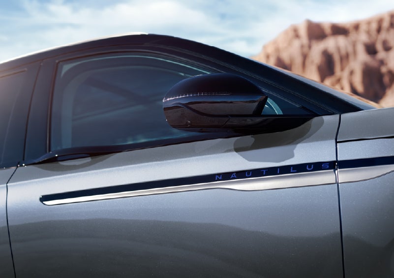 Blue lettering on the side of the vehicle that reads Nautilus indicates the available Hybrid Powertrain. | Casa Lincoln in El Paso TX