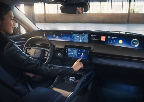 The driver of a 2026 Lincoln Nautilus® SUV interacts with the center touchscreen. | Casa Lincoln in El Paso TX