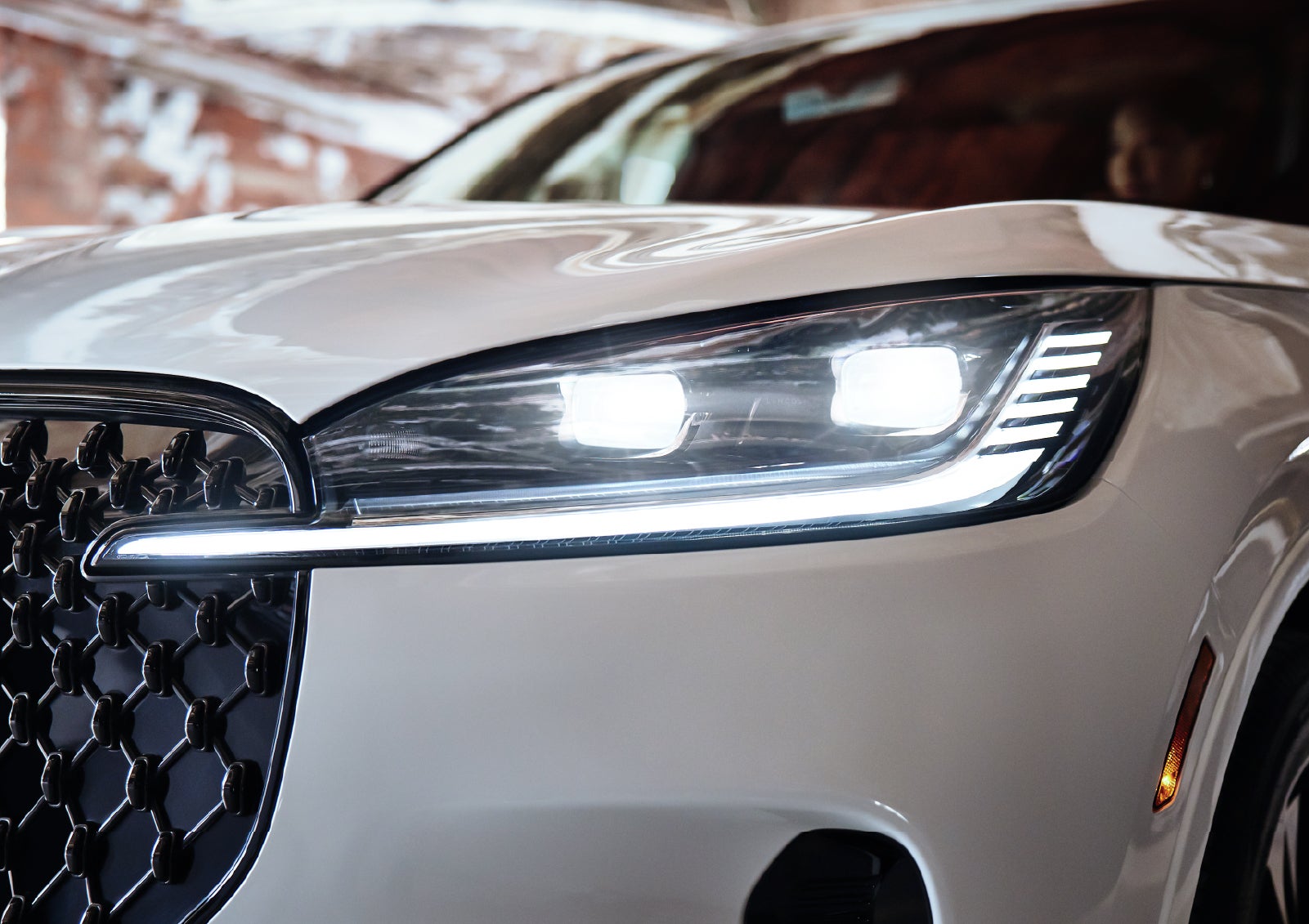 A close-up of a headlamp on the 2027 Lincoln Aviator® SUV is shown. | Casa Lincoln in El Paso TX