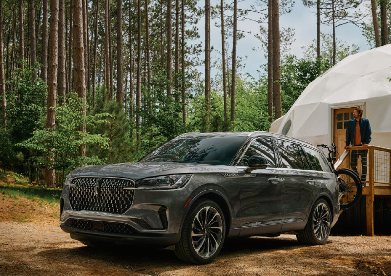 A 2027 Lincoln Aviator® is parked next to a high end glamping site. | Casa Lincoln in El Paso TX