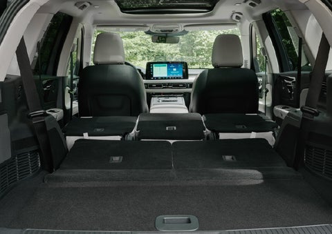 A rear to front view of the interior of a 2027 Lincoln Aviator® Black Label™ SUV shows the third and second rows folded flat | Casa Lincoln in El Paso TX