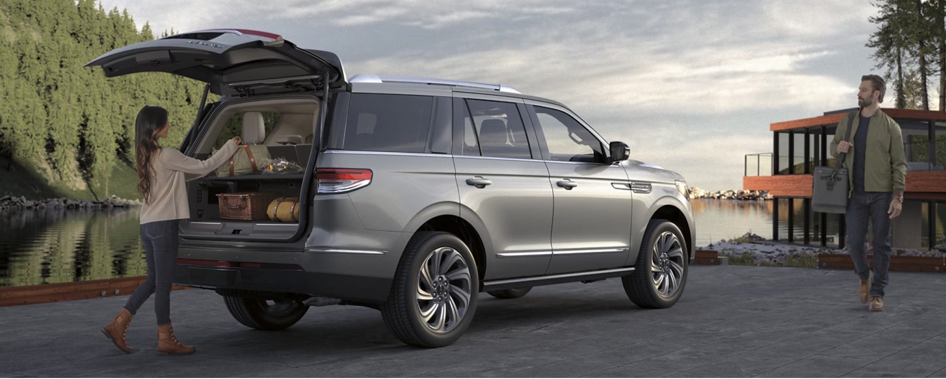 Women adding bag into the Lincoln Navigators spacious cargo