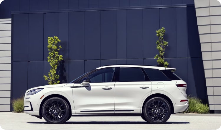 A parked white lincoln SUV